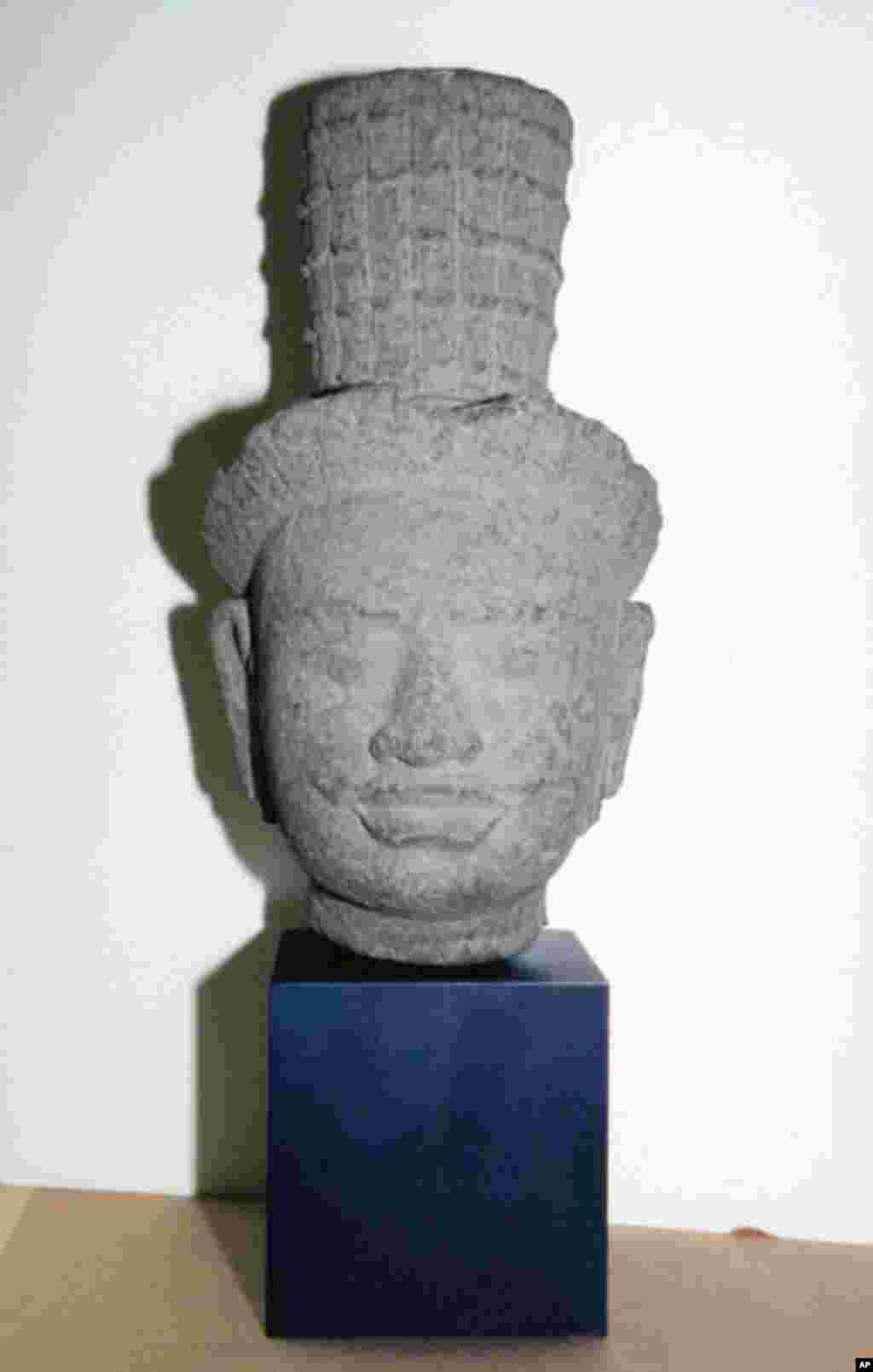 9th century head of a male deity from Angkor, Cambodia.