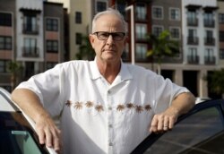 In this Wednesday, Aug. 21, 2019 photo, Greg Hunt poses for a photo in St. Petersburg, Fla. Attorneys for victims from around the country of alleged childhood sex abuse by Boy Scout officials say they are preparing to sue the organization in New…