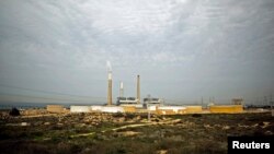 Eilat-Ashkelon Pipeline Co. oil storage containers are seen on the shore of the Mediterranean Sea in the southern city of Ashkelon, Israel, Jan. 27, 2015.
