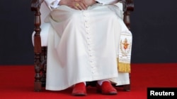 Upon retiring Pope Benedict XVI will lay aside the red "shoes of the fisherman" that have been part of his papal attire, Guanajuato airport, Silao, March 26, 2012.