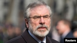 Sinn Fein president Gerry Adams arrives at the funeral of veteran British Labour politician Tony Benn at St. Margaret's Church, Westminster Abbey in London, March 27, 2014.