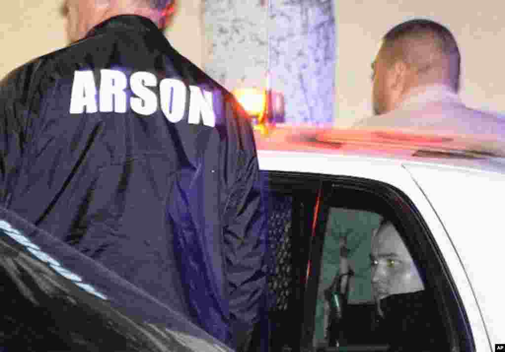 The L.A. county sheriff's department detains the man they described as a "person of interest," January 2, 2012. (Reuters)