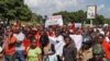 Protesters march along Kamuzu Highway in Blantyre, Malawi, April 27, 2018. 