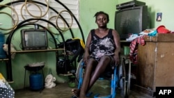 Herlande Mitile, 36 poses inside her house in Croix des Bouquets, 12.9kms (8 miles) northeast of Port-au-Prince on Dec. 30, 2019.