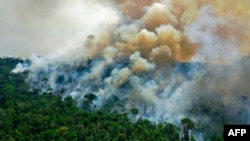 In this file photo taken on August 16, 2020, aerial view of a burning area of Amazon rainforest reserve, south of Novo Progresso in Para state, Brazil.