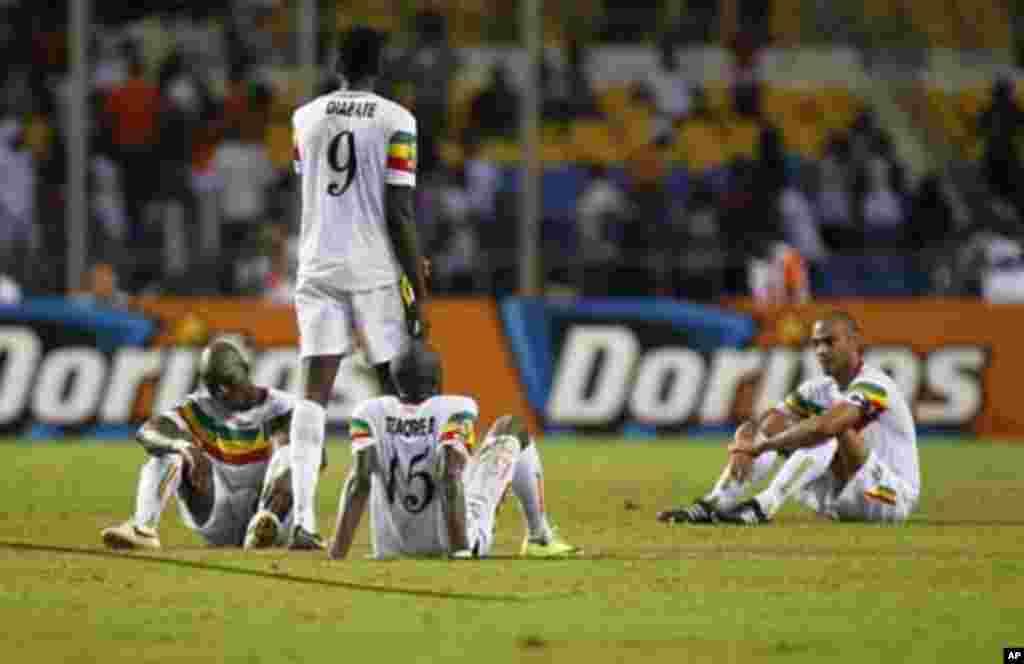 Mali's players react after they lost their African Nations Cup semi-final soccer match against Ivory Coast at the Stade De L'Amitie Stadium in Gabon's capital Libreville February 8, 2012.