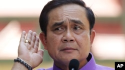 Thailand's Prime Minister Prayuth Chan-ocha listens to a question from a reporter during a press conference at the government house in Bangkok, Thailand, Tuesday, March 31, 2015. 