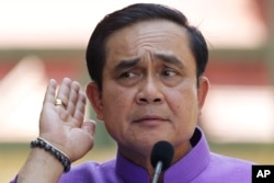 Thailand's Prime Minister Prayuth Chan-ocha listens to a question from a reporter during a press conference at the government house in Bangkok, Thailand, Tuesday, March 31, 2015.