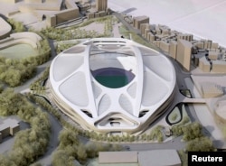FILE - A rendering model of the new National Stadium for 2020 Tokyo Olympics and Paralympics, designed by Iraqi-British architect Zaha Hadid, is displayed at a meeting of members of the advisory council on the construction of the new stadium in Tokyo.