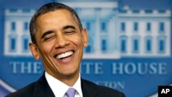 President Barack Obama smiles during an end-of-the year news conference, Dec. 20, 2013.