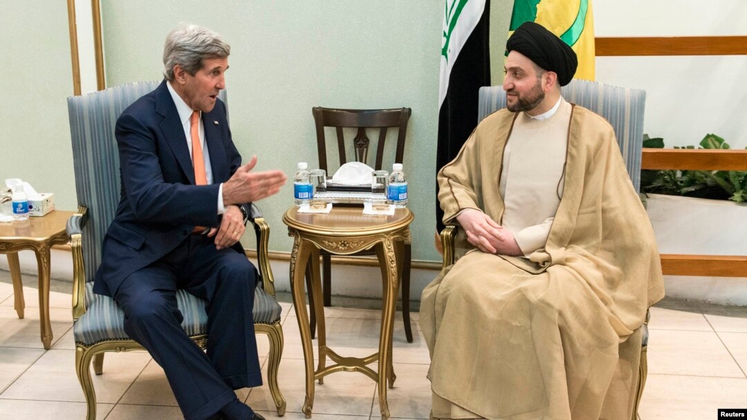Ammar al-Hakim, pimpinan ISCI (Islamic Supreme Council of Iraq) saat bertemu dengan Menlu AS John Kerry (kiri) di Baghdad (23/6).