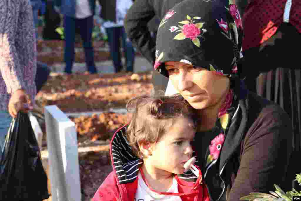 Displaced Afrin people visit the graves of their beloved ones in the eid