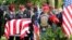 FILE - An honor guard carries the coffin of U.S. Army Sergeant La David Johnson, who was among four special forces soldiers killed in Niger, at a graveside service in Hollywood, Florida, Oct. 21, 2017. 