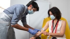 In this undated photo from the University of Oxford, a volunteer received a coronavirus vaccine developed by AstraZeneca and Oxford University, in Oxford, England. (University of Oxford/John Cairns)