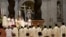 FILE - Pope Francis blesses a newly ordained priest during a mass in Saint Peter's Basilica at the Vatican, April 22, 2018.