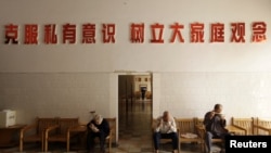 Elderly residents eat their lunch at a nursing home in Henan province, China.