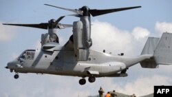 FILE - A US Air Force V-22 Osprey prepares to land near the command post prior to live fire drills on the last day of the annual US-Philippine joint military exercise at the former US traget range in Crow Valley, Capas town, north of Manila on May 15, 201