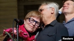 FILE — Lee Carter, whose mother traveled to Switzerland to end her life in 2010, speaks to journalists at the Supreme Court of Canada in Ottawa, Feb. 6, 2015. Doctor-assisted suicide has been available in Canada since 2016 for individuals whose death is "reasonably foreseeable."