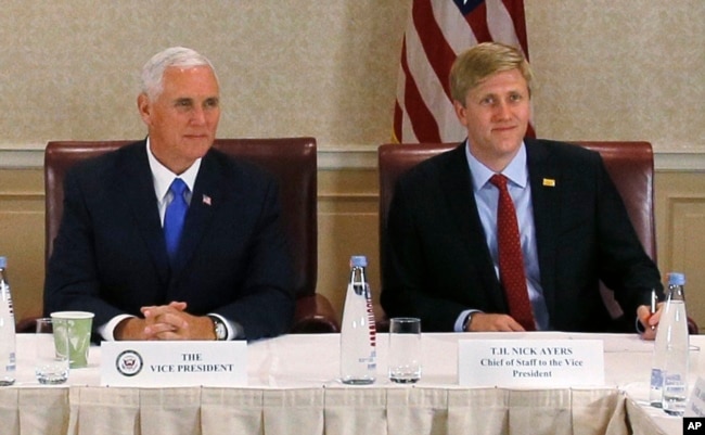 FILE - Vice President Mike Pence, left, attends a meeting with Georgia opposition leaders in Tbilisi, Georgia. Chief of Staff to the Vice President, Nick Ayers, is right.