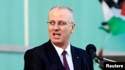 FILE - Palestinian Prime Minister Rami al-Hamdallah told the Al-Quds newspaper that the Palestinian government had expected to get $1.2 billion in foreign financial support and offers in the current financial year but had received only $640 million.