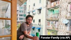 This undated photo provided by the family courtesy shows Danny Fenster posing for a photo in Yangon, Myanmar. A court in military-ruled Myanmar on Friday, Nov. 12, 2021, sentenced detained U.S. journalist Fenster to 11 years in prison. (family courtesy photo via AP)