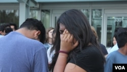 Alisha Marcial, daughter of Vicente Marcial Noyola, gets emotional during a vigil in front of the Raleigh, NC, jail where her father is detained. Marcial said she has a "very close relationship with my dad." (A.Barros/VOA)