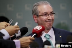 FILE- President of Brazil's Chamber of Deputies Eduardo Cunha speaks during a news conference at the Chamber of Deputies in Brasilia, Dec. 7, 2015.