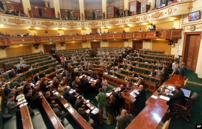 FILE - Egyptian Shura Council members meet in the parliament's upper house, April 23, 2013.