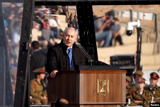 Israeli Prime Minister Benjamin Netanyahu speaks at the Israeli Air Force pilots' graduation ceremony at Hatzerim air base in southern Israel, Dec. 26, 2018.
