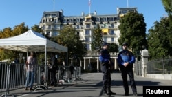 Lausanne police officers stand guard outside the Beau-Rivage Palace ahead of Syria talks in Lausanne, Switzerland, Oct. 15, 2016. After the suspension of U.S.-Russian bilateral talks, the effort took on a multilateral format.