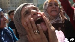 The mother of Abbas Medlej, a missing Lebanese soldier who was kidnapped by Islamic State militants, shouts slogans during a demonstration to demand action to secure the captive's release, in front the Lebanese government building, in downtown Beirut, Sep