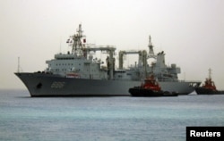FILE - Chinese navy warships arrive at the seaport of Port Sudan.
