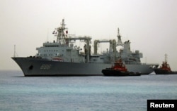 FILE - Chinese navy warships arrive at the seaport of Port Sudan, Aug. 25, 2015.