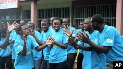 On World AIDS Day in Rwanda, teenagers in the capital rally against the spread of HIV/AIDs at an event organized by the government, Kigali, December 1, 2011.