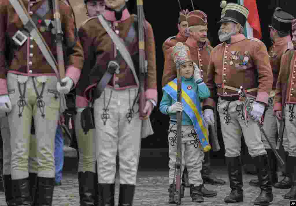 Ethnic Hungarians wearing Hussar uniforms take part in a parade in Targu Secuiesc, Romania.