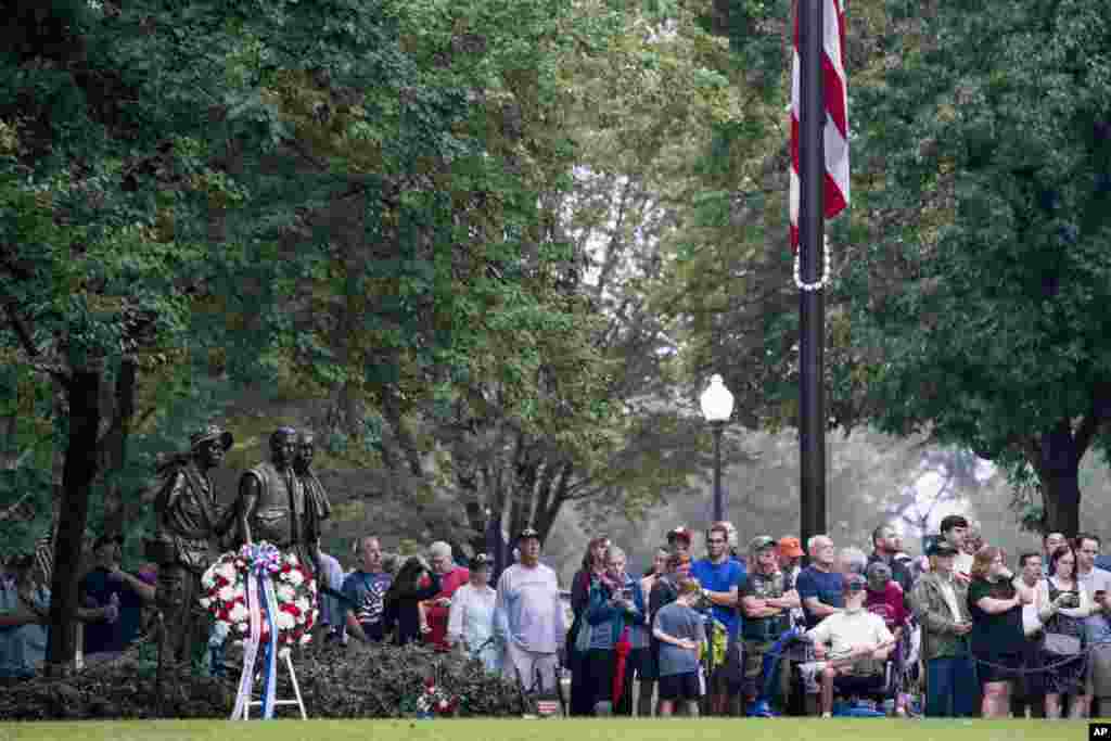 A crowd is seen gathered before Cindy McCain, wife of Sen. John McCain, arrives to lay a wreath at the Vietnam Veterans Memorial in Washington, Sept. 1, 2018.