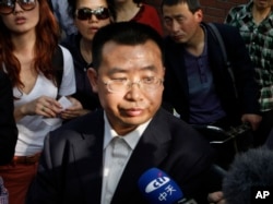FILE - Human rights activist Jiang Tianyong speaks to journalists in Beijing, China, May 2, 2012.