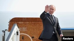 8일 앙겔라 메르켈 독일 총리와 정상회담을 위해 독일 하노바를 방문한 블라디미르 푸틴 대통령.
