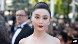 FILE - Fan Bingbing poses for photographers as she arrives for the screening of the film "The Beguiled" at the 70th international film festival, Cannes, southern France, May 24, 2017. (AP Photo/Thibault Camus, File)