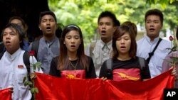 Myanmar students participate in a ceremony marking the 53rd anniversary of a 1962 student uprising at Yangon University, Myanmar, July 7, 2015