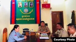 Deputy police chief Sithong Sokha meets with Stung Treng police officials after she posted a photo of herself breastfeeding her child while on the job. (Courtesy photo)