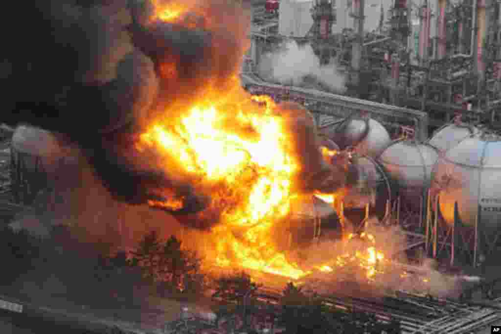 Natural gas storage tanks burn at a facility in Chiba Prefecture, near Tokyo, Japan March 11, 2011 - (Reuters)