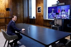 FILE - Austria's Chancellor Sebastian Kurz waits for the start of an EU summit held via video conference, in his office, in Vienna, Austria, March 25, 2021.