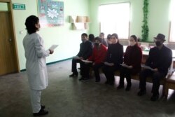 A nurse explains details about COVID 19 and ways to prevent contracting it at the Phyongchon District People's Hospital, April 1, 2020, in Pyongyang, North Korea.