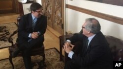 FILE - Organization of American States Secretary General Luis Almagro, right, hosts opposition Venezuelan congressman Freddy Guevara at the OAS headquarters in Washington, Feb. 10, 2017.