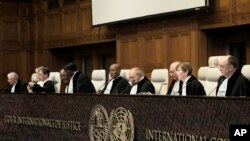 FILE - Judges preside over the opening of the hearings at the International Court of Justice in The Hague, Netherlands, January 11, 2024.