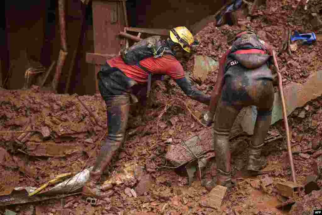 Firefighters search for missing persons after a landslide in Vila Bernadete, Belo Horizonte, Minas Gerais state, Brazil.