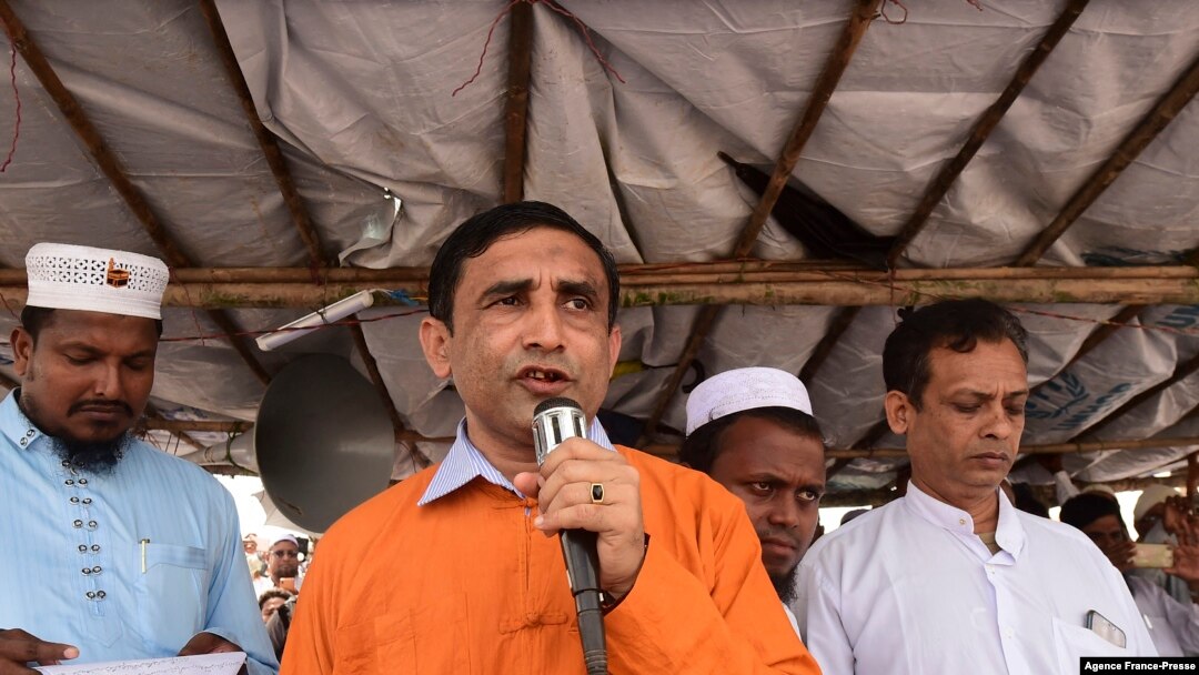 FILE - Mohib Ullah, a leader for the Rohingya community, addresses a gathering at the Kutupalong refugee camp in Ukhia on Aug. 25, 2019.