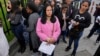 Gloria Camacho holds a notification stating her visa appointment was canceled outside the US embassy in Bogota, Colombia, Jan. 27, 2025.