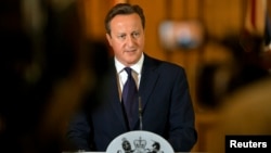 Britain's Prime Minister David Cameron makes a statement to the media following the killing of British aid worker David Haines, at Number 10 Downing Street in London September 14, 2014.